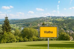 Ein gelbes Straßenschild mit der Aufschrift